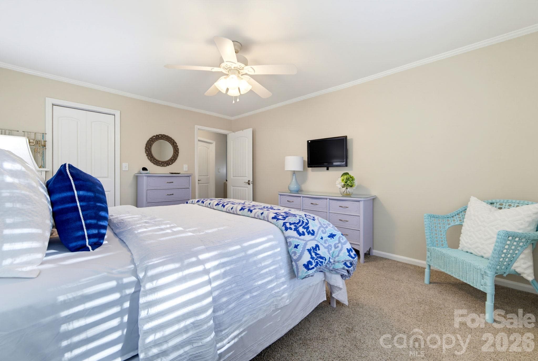 Another view of the primary bedroom highlights the generous proportions and flexibility for a sitting or reading area. - 5901 Quail Hollow Road, Charlotte