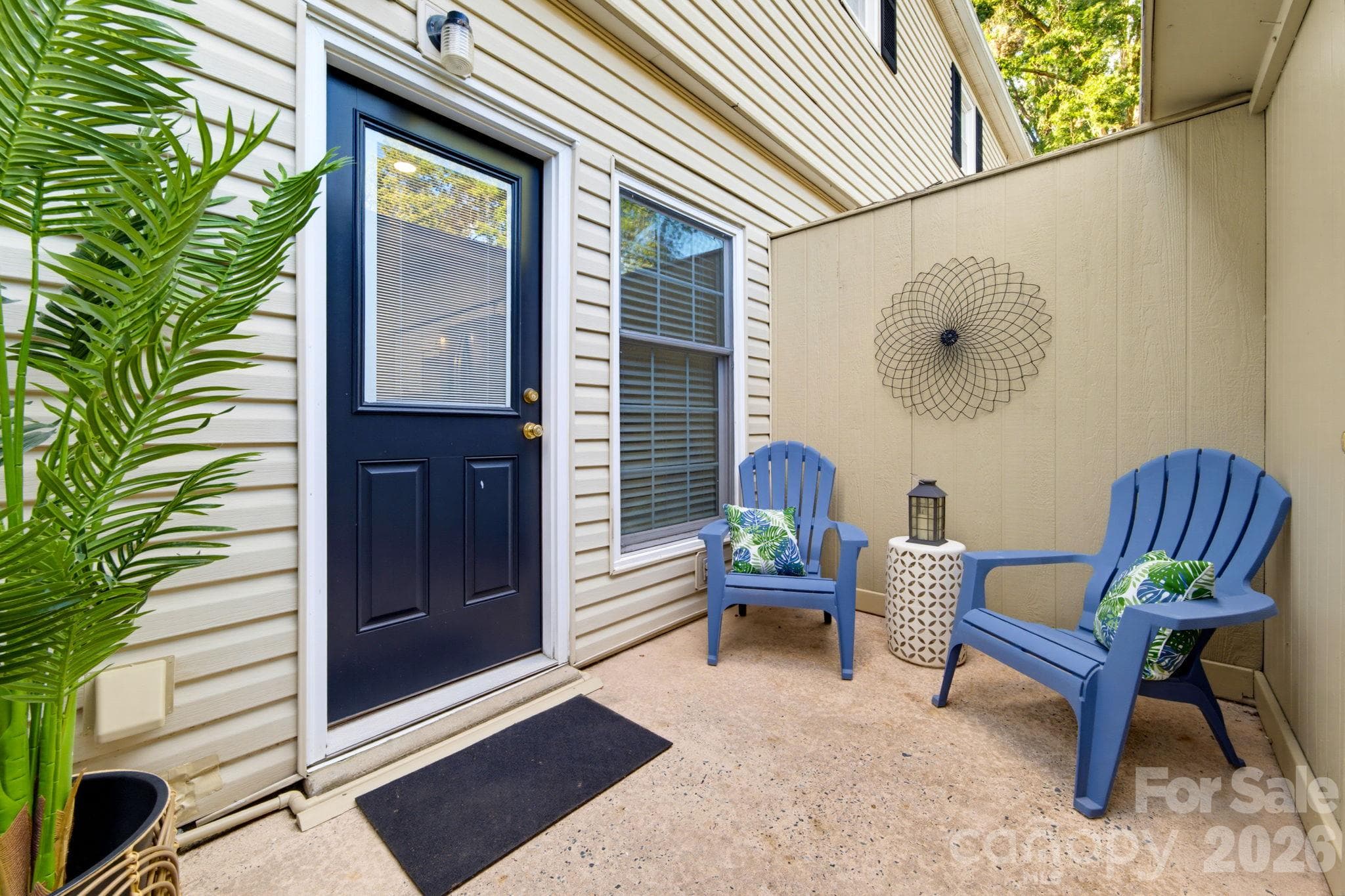 Additional front patio offers a welcoming seating area with direct access to the home. - 5901 Quail Hollow Road, Charlotte