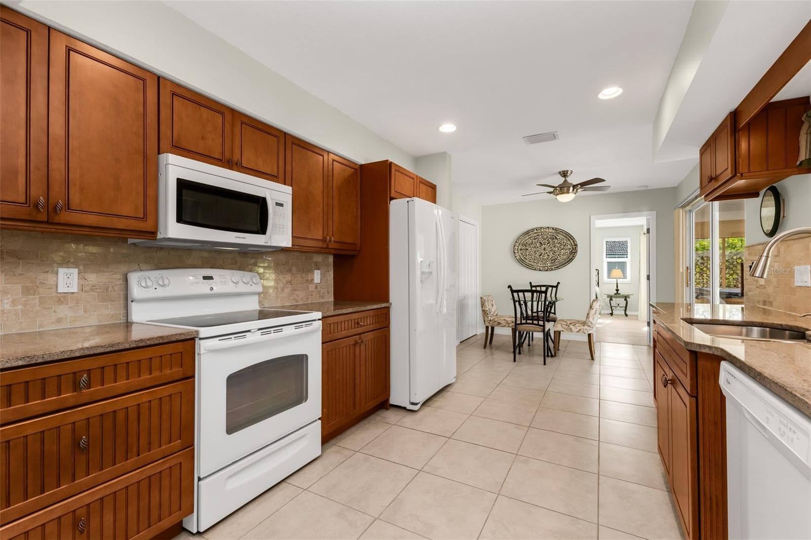Spacious kitchen with solid wood cabinets and soft-close drawers. - 1311 TUSCANY DR, PUNTA GORDA