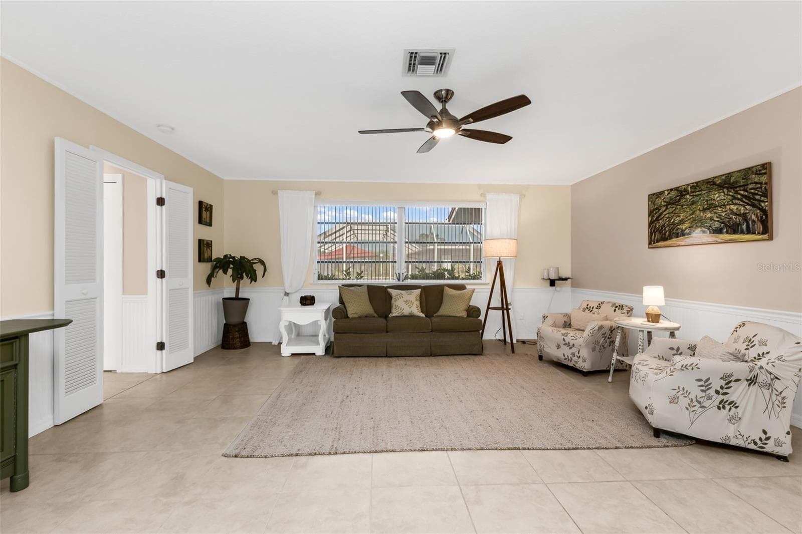 Family room open to the kitchen with sliders to lanai. - 1311 TUSCANY DR, PUNTA GORDA