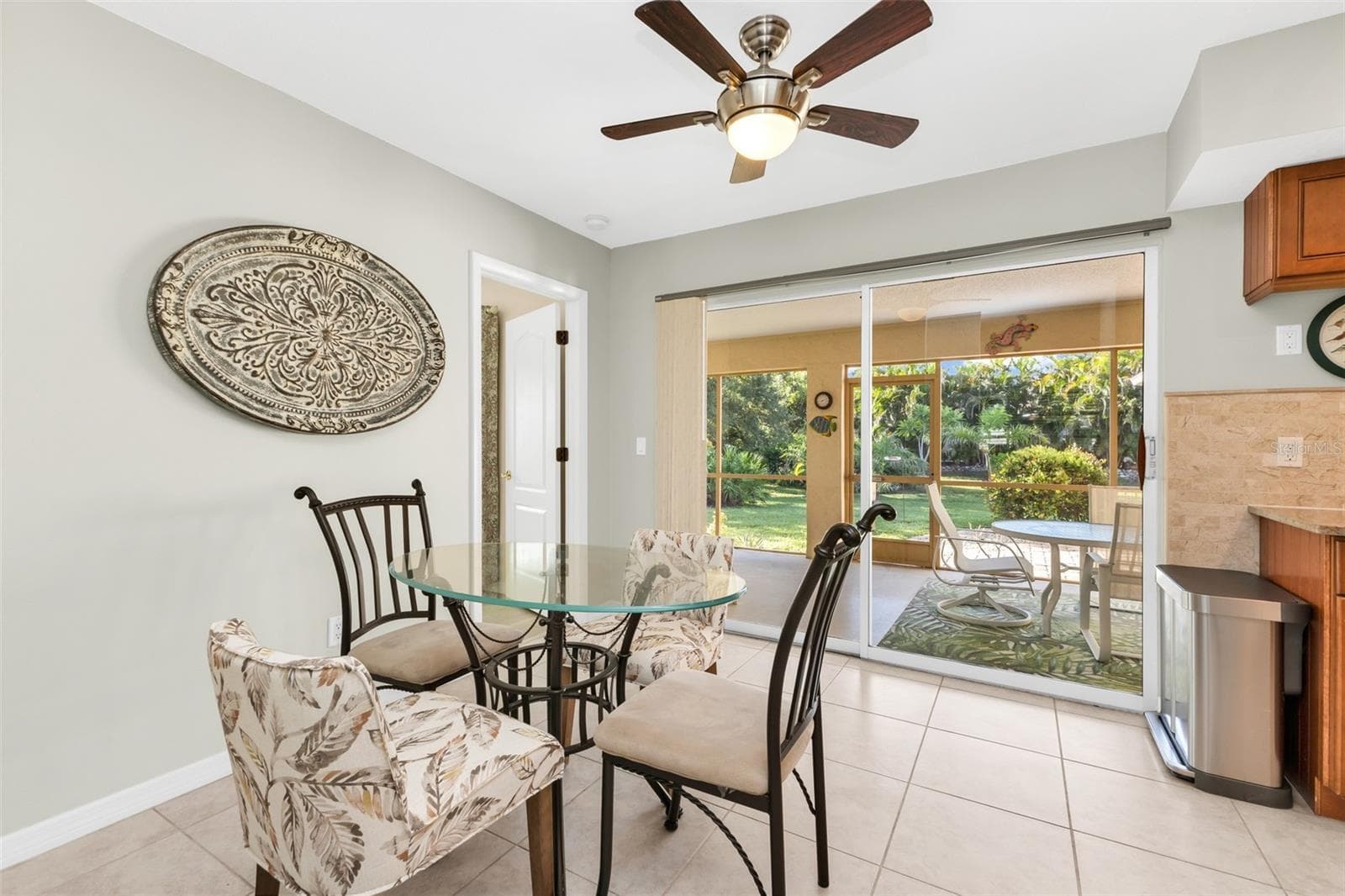 Dining nook with sliders to lanai. - 1311 TUSCANY DR, PUNTA GORDA