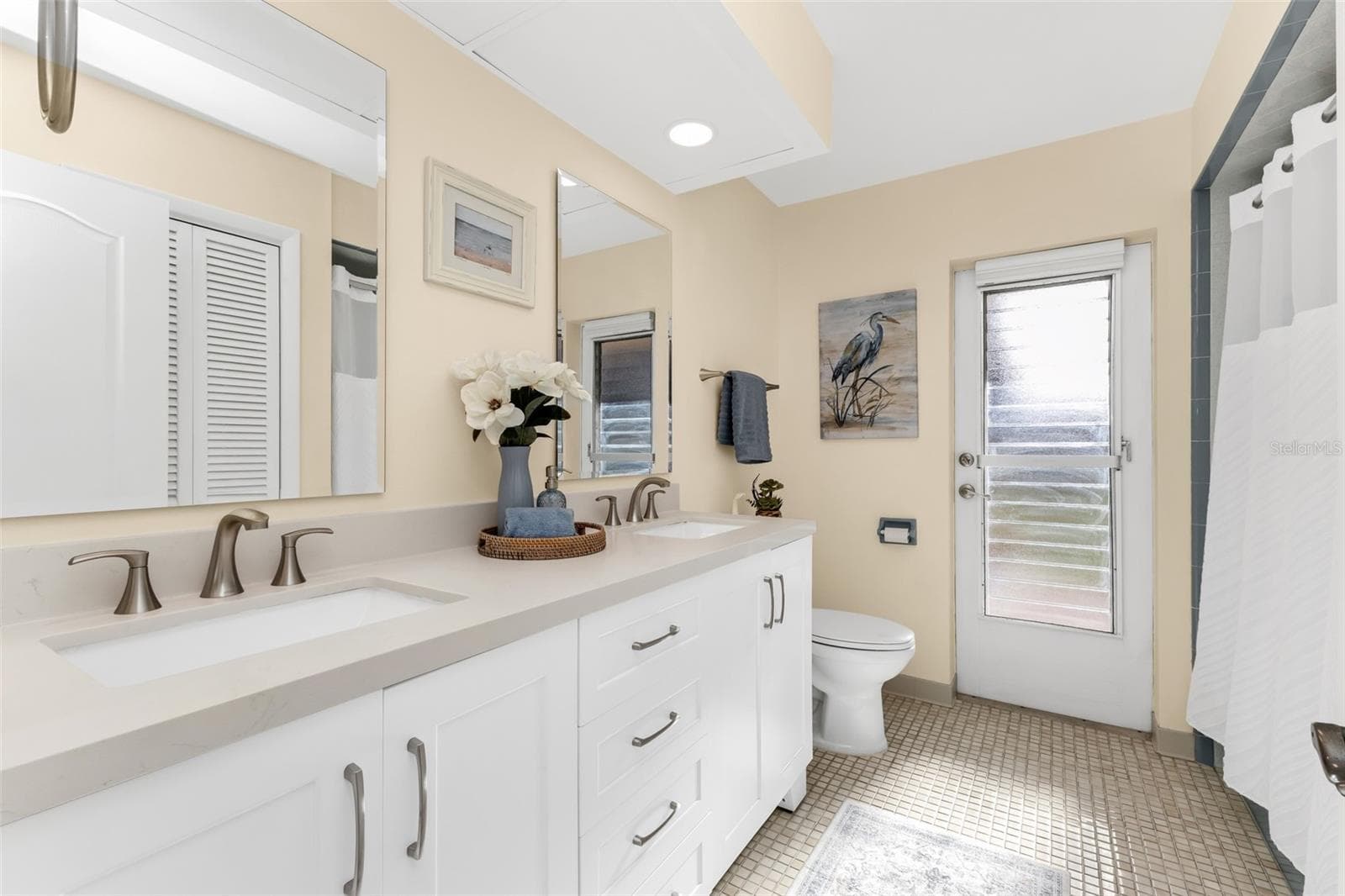 Updated guest bath with access to patio. - 1311 TUSCANY DR, PUNTA GORDA