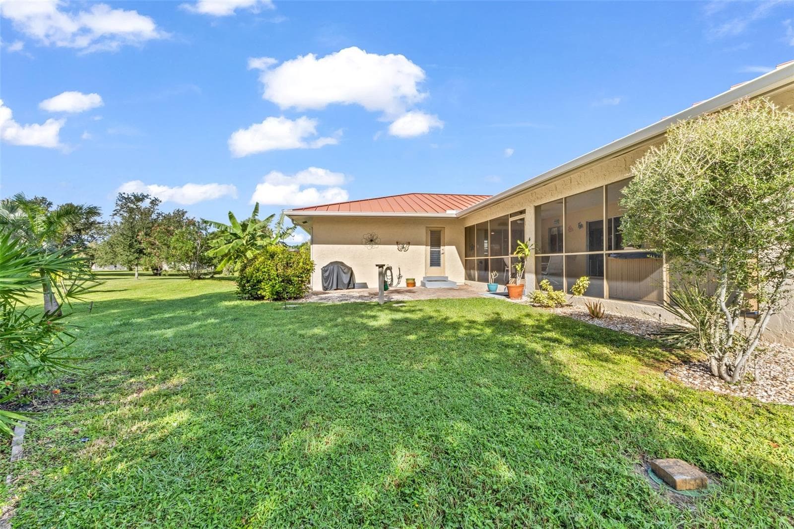 Private backyard with mature landscaping and room for a pool. - 1311 TUSCANY DR, PUNTA GORDA