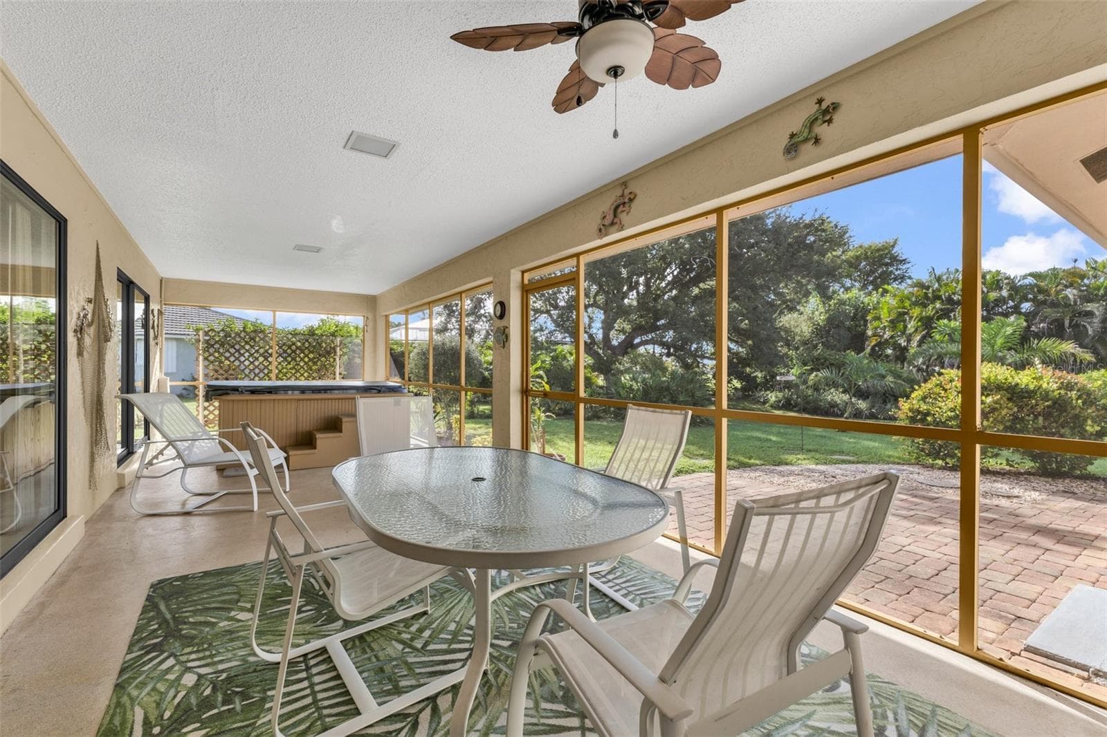 Screened lanai with a relaxing spa. Peaceful setting with room to build a pool. - 1311 TUSCANY DR, PUNTA GORDA