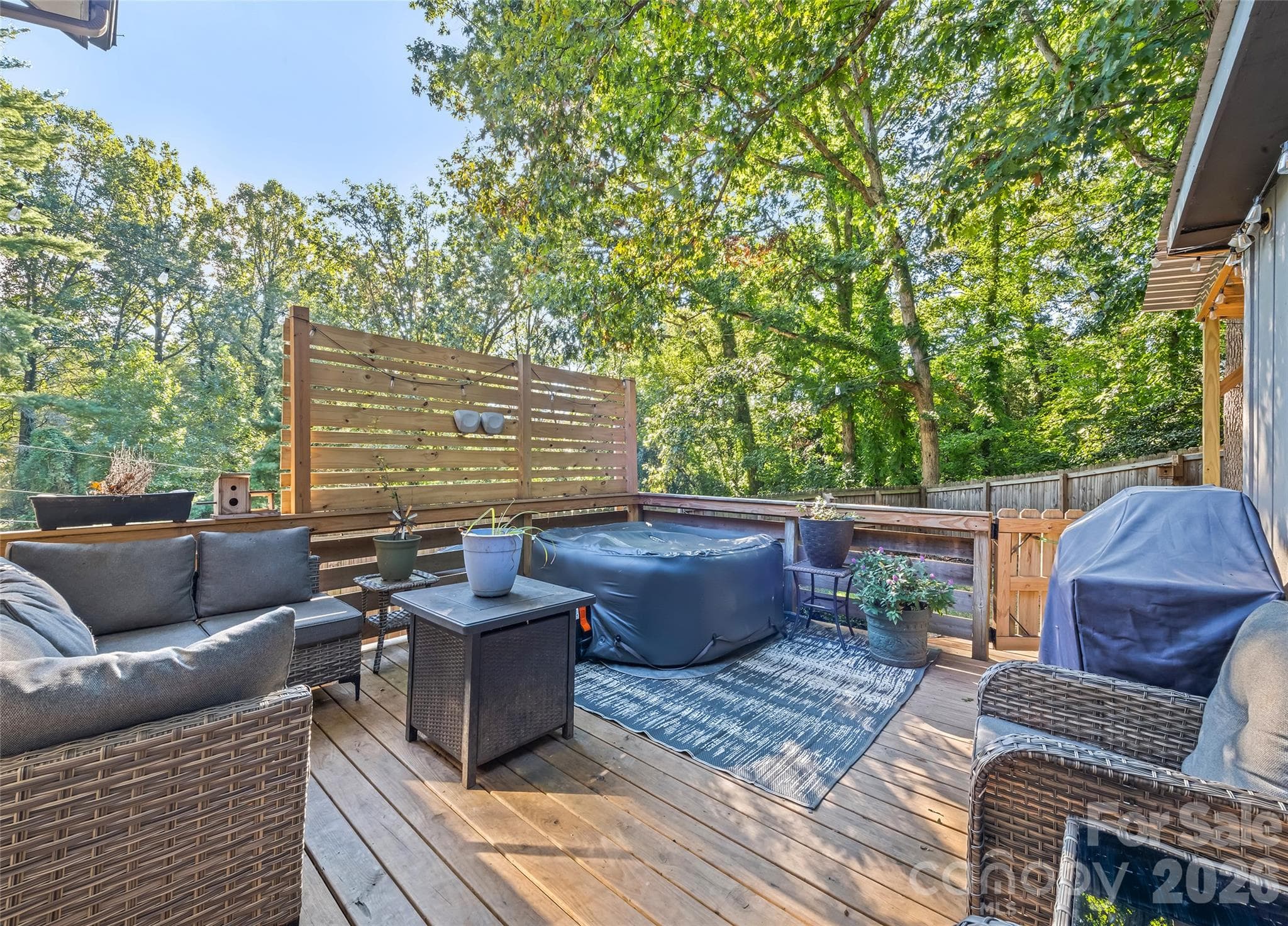 Out the sliding doors is your outdoor oasis -hot tub and outdoor fireplace convey. - 177 Forest Drive, Clyde