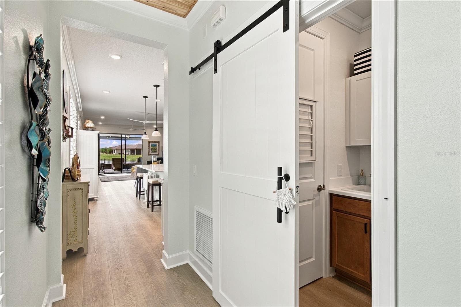 Laundry room w/barn door - 1120 VIA GALUPPI ST, POINCIANA