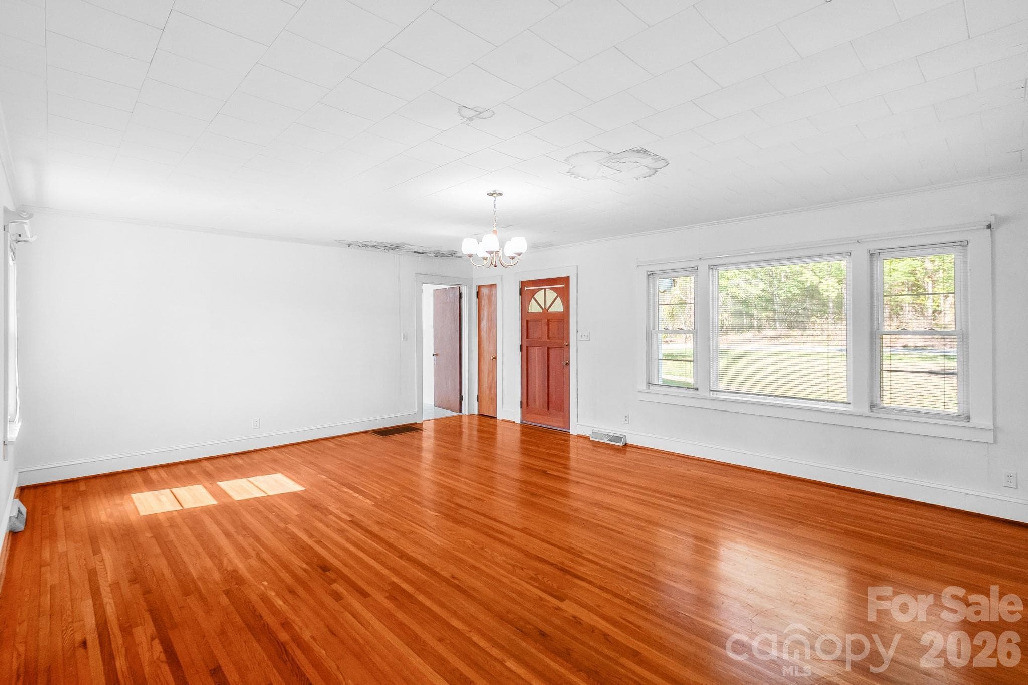 Living Room with front door entry - 7615 S Rocky River Road, Monroe