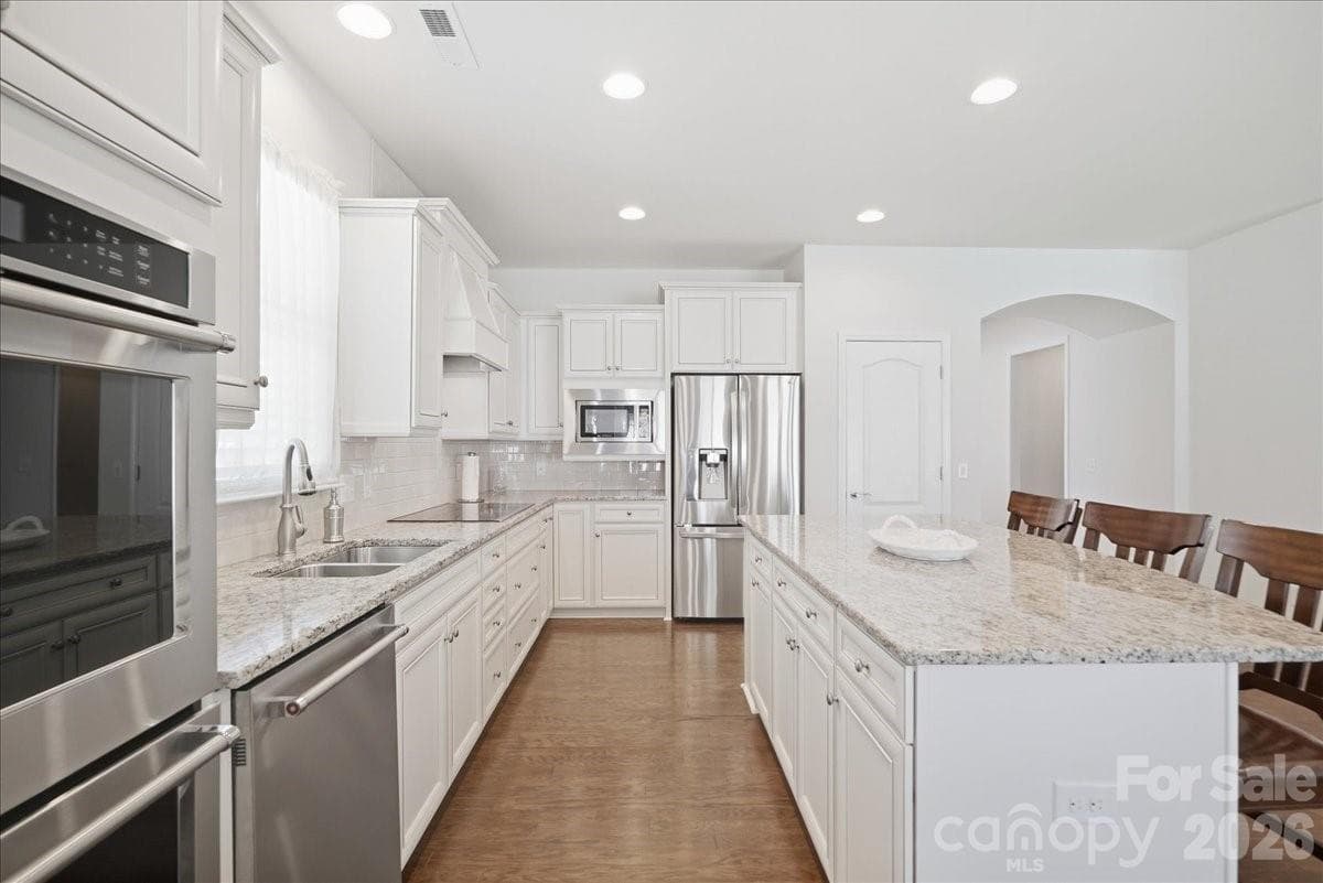 Antique white cabinets, refrigerator included - 389 Harvest Valley Lane, Fort Mill