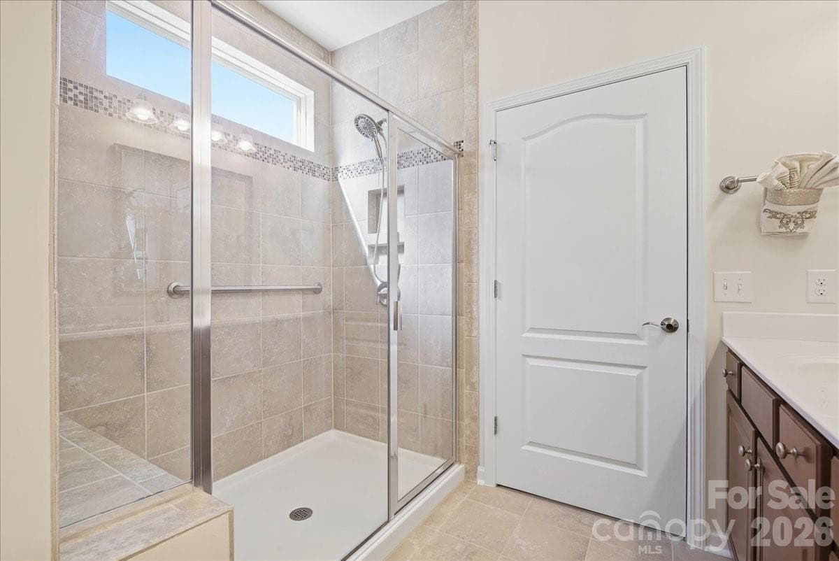 Primary bath shower w/tile and glass doors - 389 Harvest Valley Lane, Fort Mill