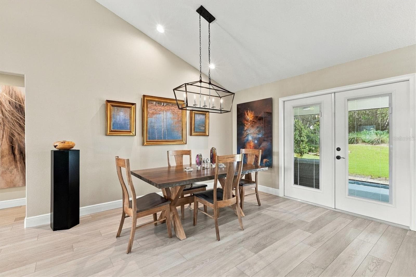 LOVELY DINING AREA WITH ENTRANCE TO SCREENED PATIO - 6791 SW 179TH COURT RD, DUNNELLON