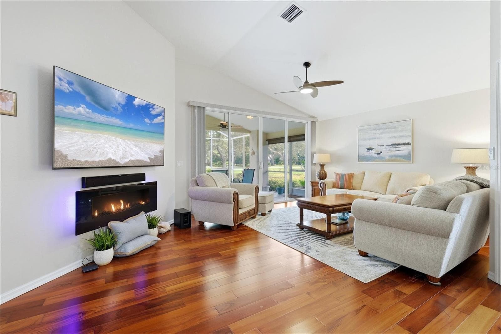 Living room with electric fireplace - 4620 DEER TRAIL BLVD, SARASOTA