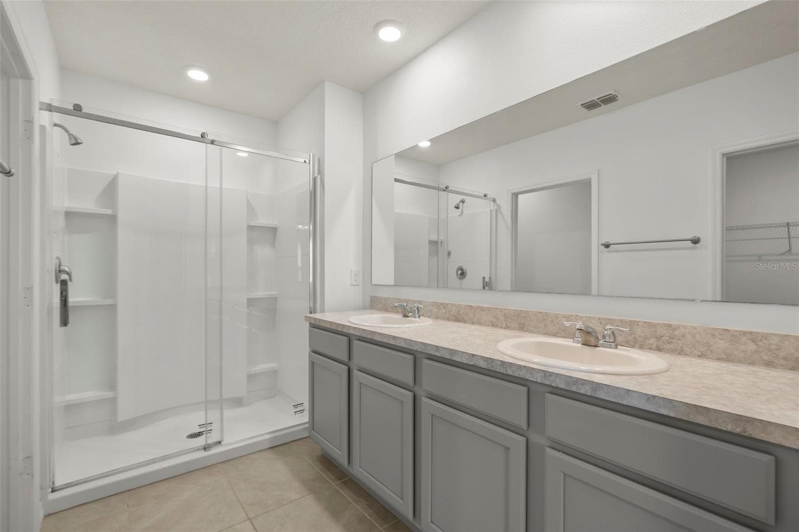 Primary bathroom featuring a spacious vanity and walk-in shower. - 3658 CASPIAN ST, LEESBURG