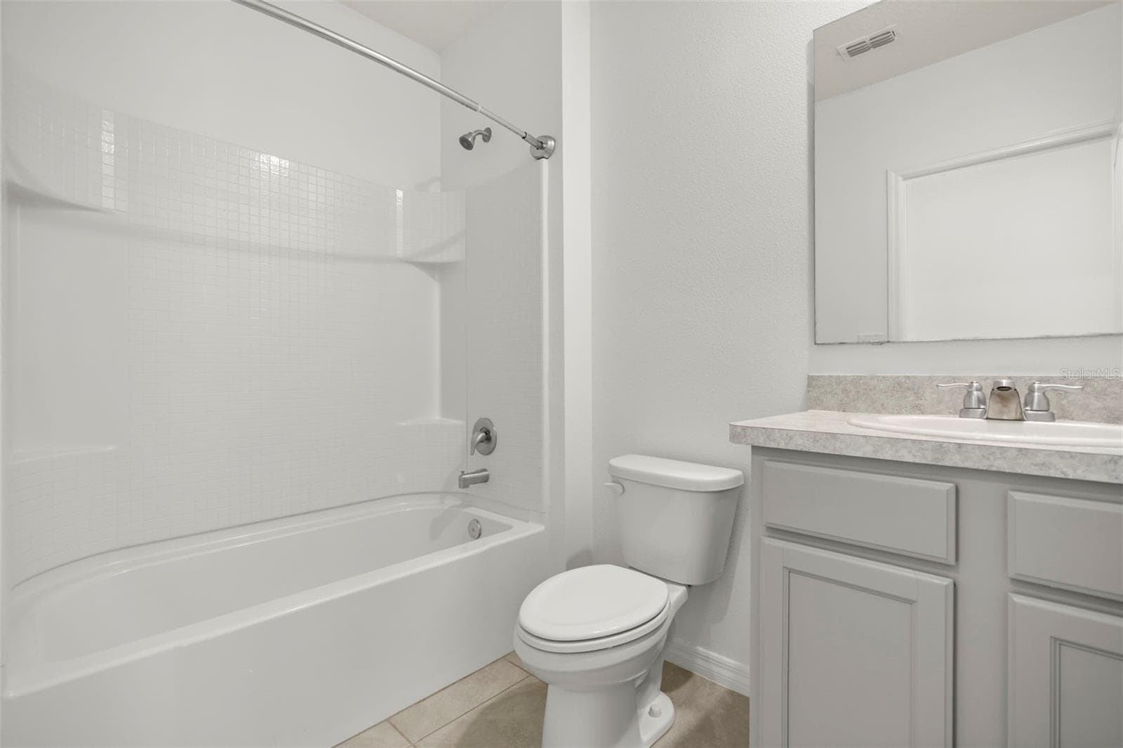 Full guest bathroom with tub/shower combination and vanity. - 3658 CASPIAN ST, LEESBURG