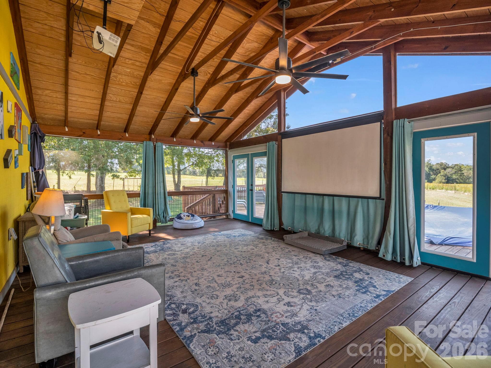 large screened porch with projector & sound bar - 131 Burch Hutchins Road, Forest City