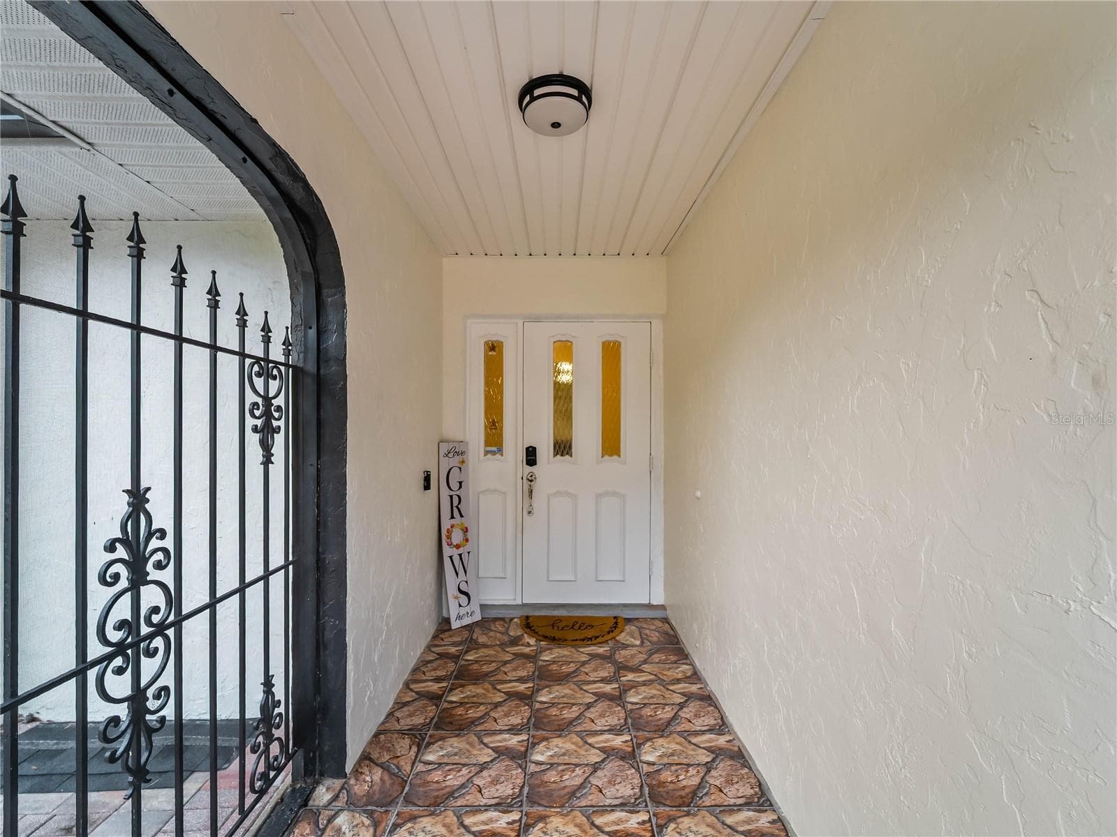 Screened, tiled front entry.  Best for cross-ventilation during our cooler months. - 20343 RUTHERFORD AVE, PORT CHARLOTTE