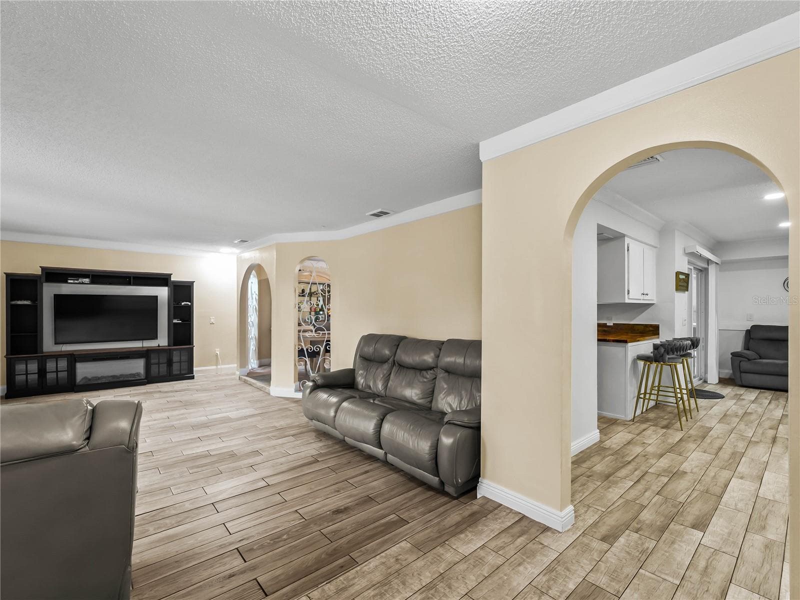 View from the foyer: living room on the left, kitchen and family room on the right. - 20343 RUTHERFORD AVE, PORT CHARLOTTE