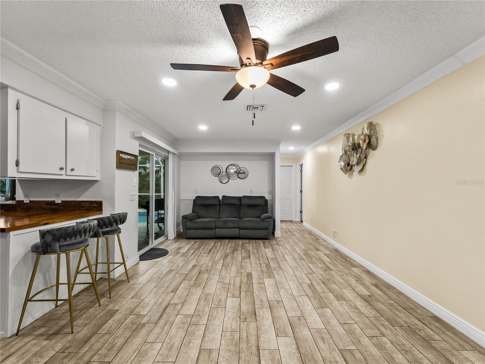 Family room looking from the foyer.  Bedroom 2, guest bath, and linen closet down the hall to the right. - 20343 RUTHERFORD AVE, PORT CHARLOTTE