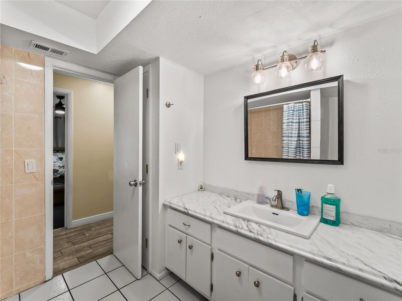 Guest bath - view 2.  This space easily accommodate a dual sink vanity. - 20343 RUTHERFORD AVE, PORT CHARLOTTE