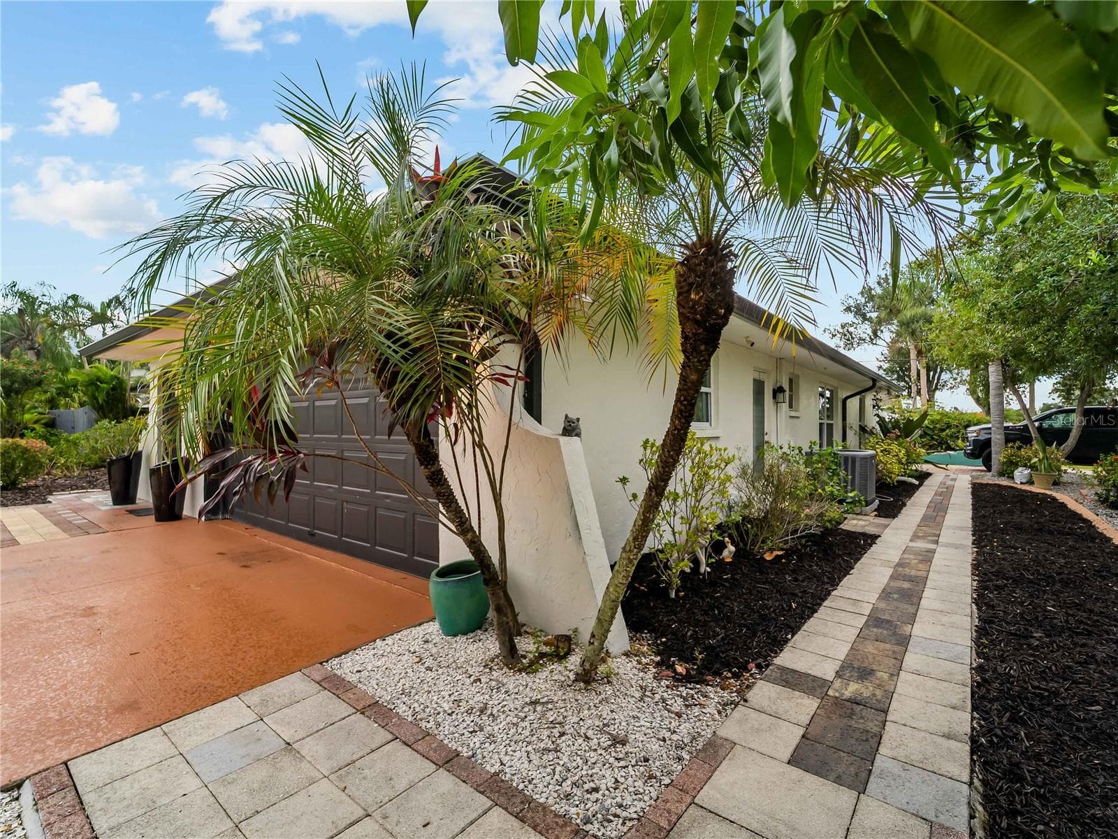 This paver sidewalk connects the two driveways. - 20343 RUTHERFORD AVE, PORT CHARLOTTE
