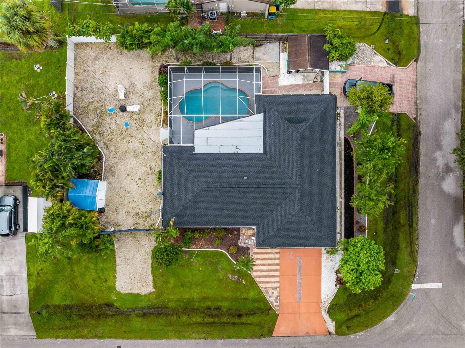 Ample driveway parking, vehicle access to the shed off Atlas St., and plenty of room for boat or RV on the left side. - 20343 RUTHERFORD AVE, PORT CHARLOTTE
