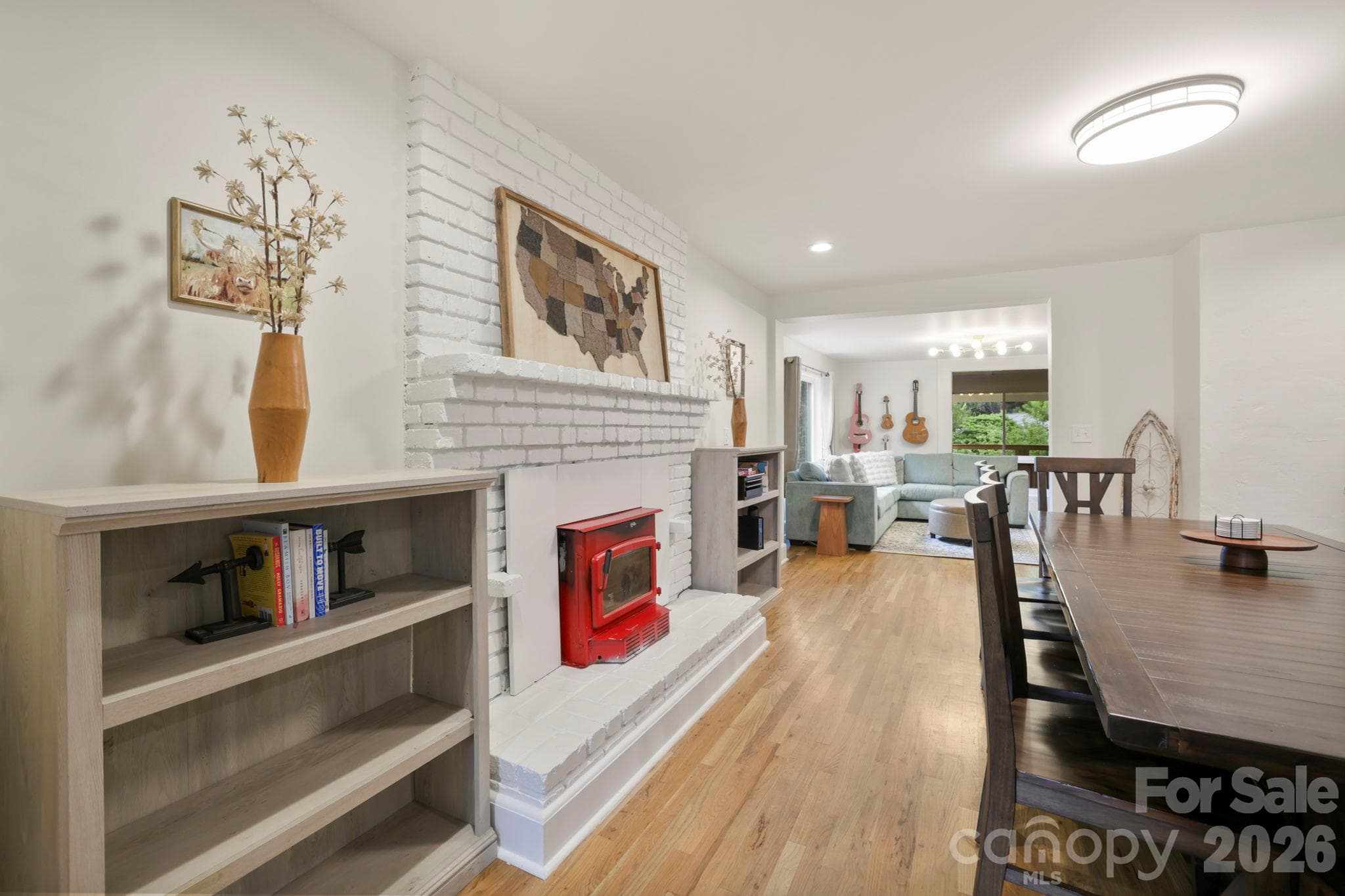 In cooler temps, the wood-burning stove insert keeps it cozy - 2252 Riceville Road, Asheville