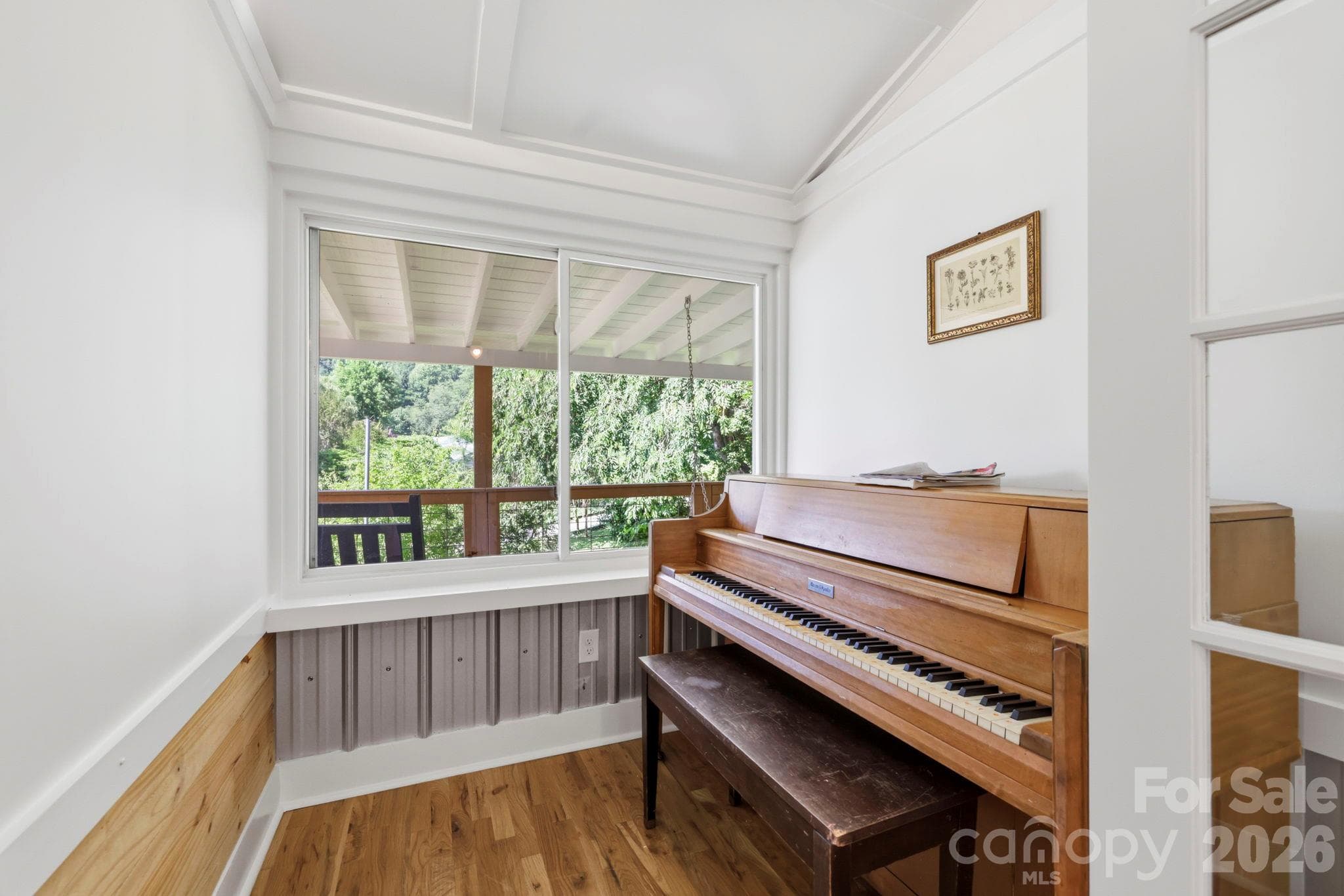 Separated by a glass door from the living area, this bonus room could be an office, exercise or play area - 2252 Riceville Road, Asheville