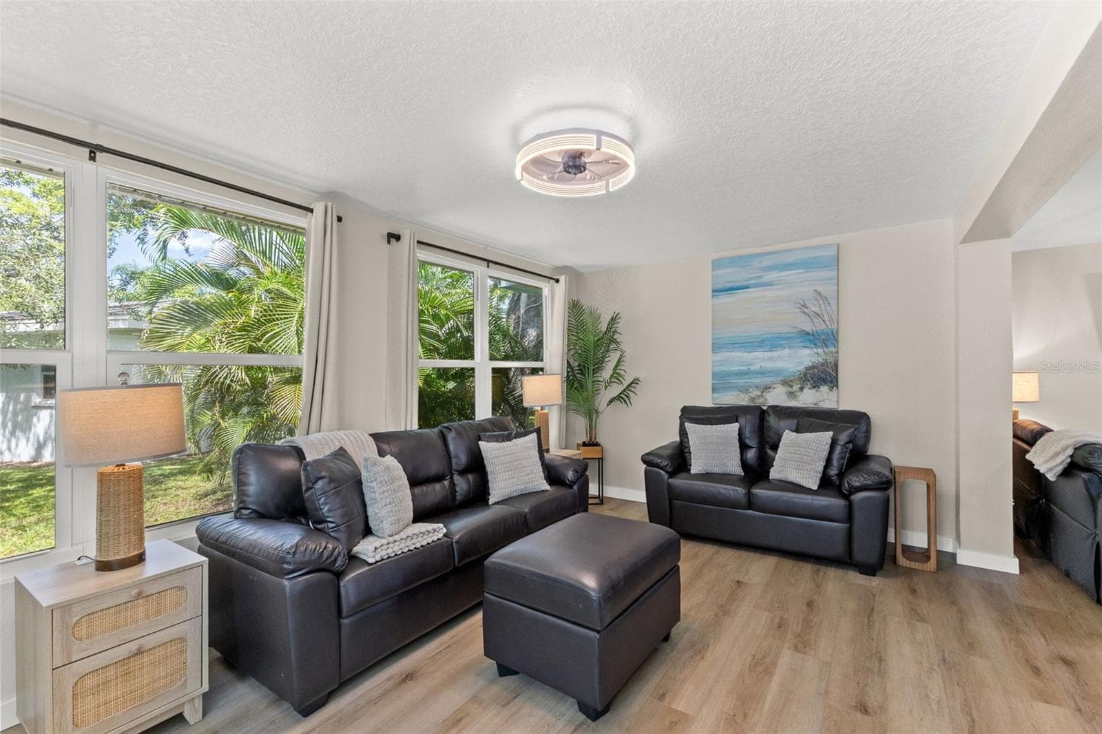 The home’s single-story layout offers generous, connected living spaces with updated flooring and a bright, neutral interior. - 201 SOUTH ST, PALM HARBOR