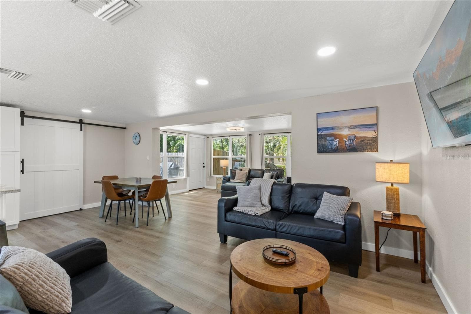 Open dining and living spaces provide plenty of room for everyday living and entertaining. - 201 SOUTH ST, PALM HARBOR