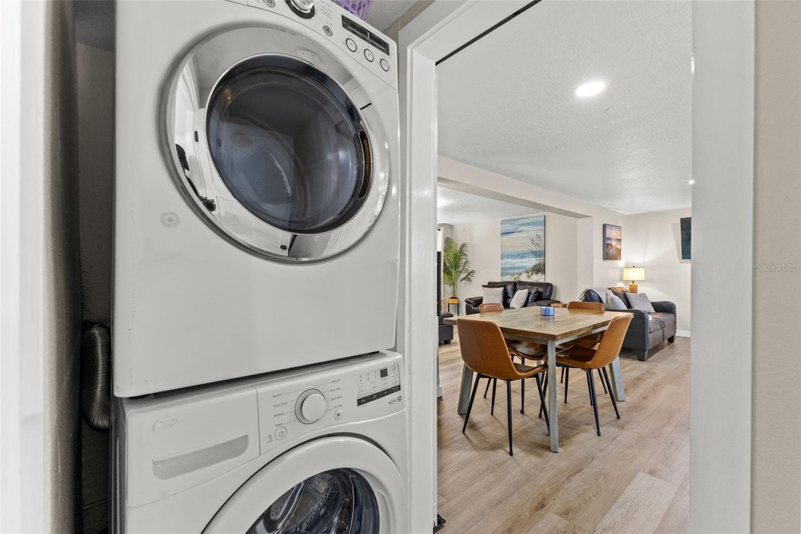 Convenient interior laundry with a full-size stacked washer and dryer just off the main living and dining areas. - 201 SOUTH ST, PALM HARBOR