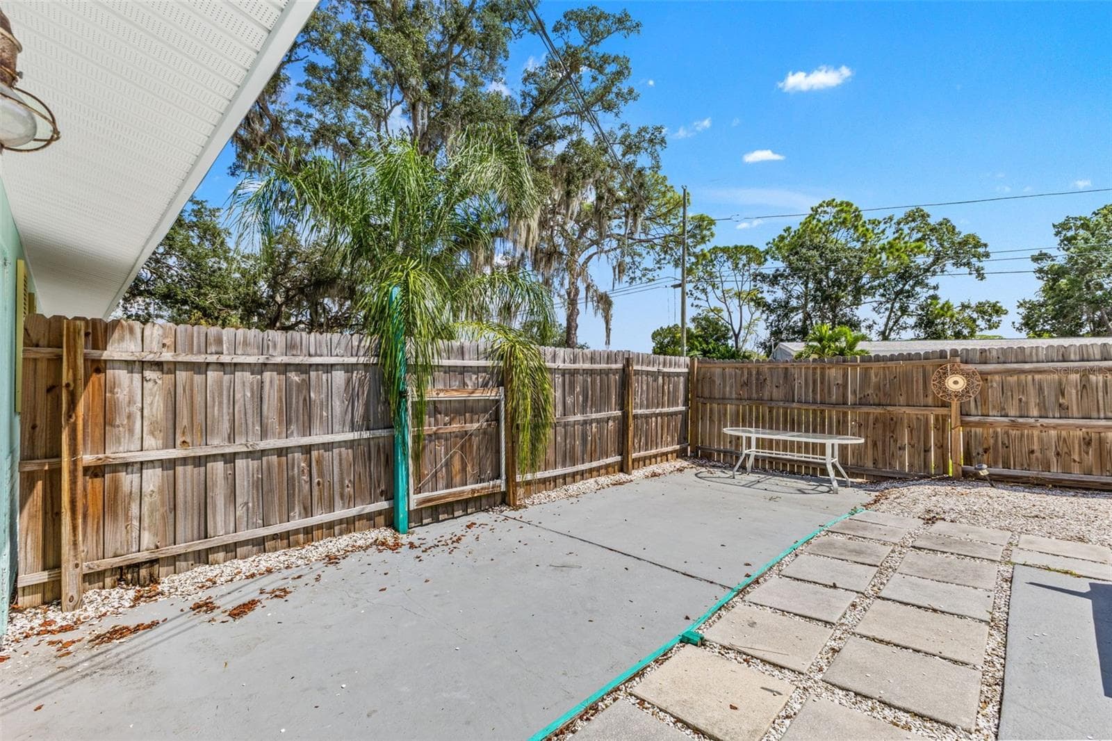Additional fenced patio space offers even more room for outdoor dining, grilling, or creating a separate sitting area. - 201 SOUTH ST, PALM HARBOR