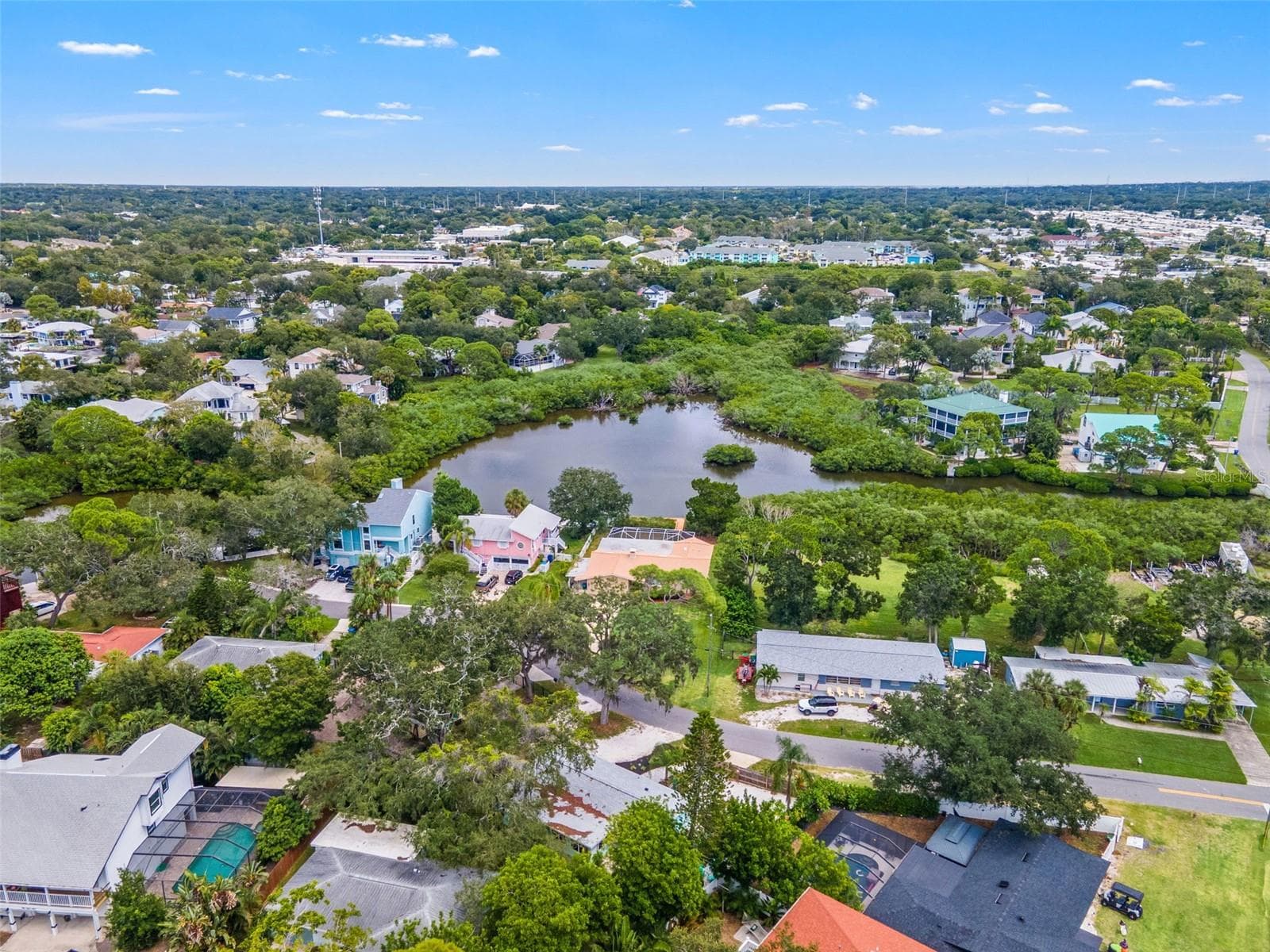 Aerial view of the surrounding Ozona neighborhood, with waterfront homes, natural waterways, and marinas nearby. - 201 SOUTH ST, PALM HARBOR