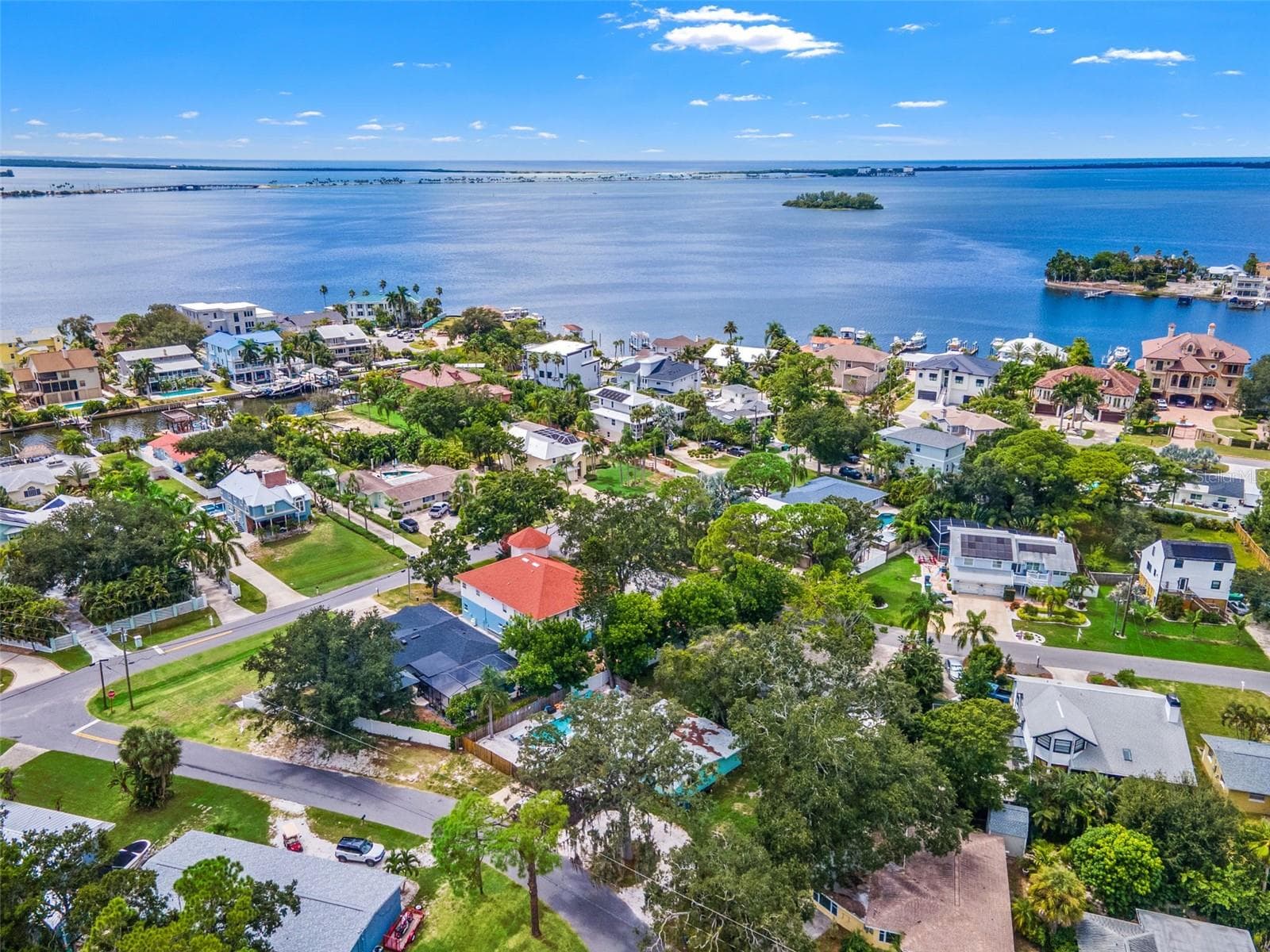 Ozona’s unique setting comes into view, with nearby waterfront neighborhoods and the open waters of St. Joseph Sound beyond. - 201 SOUTH ST, PALM HARBOR
