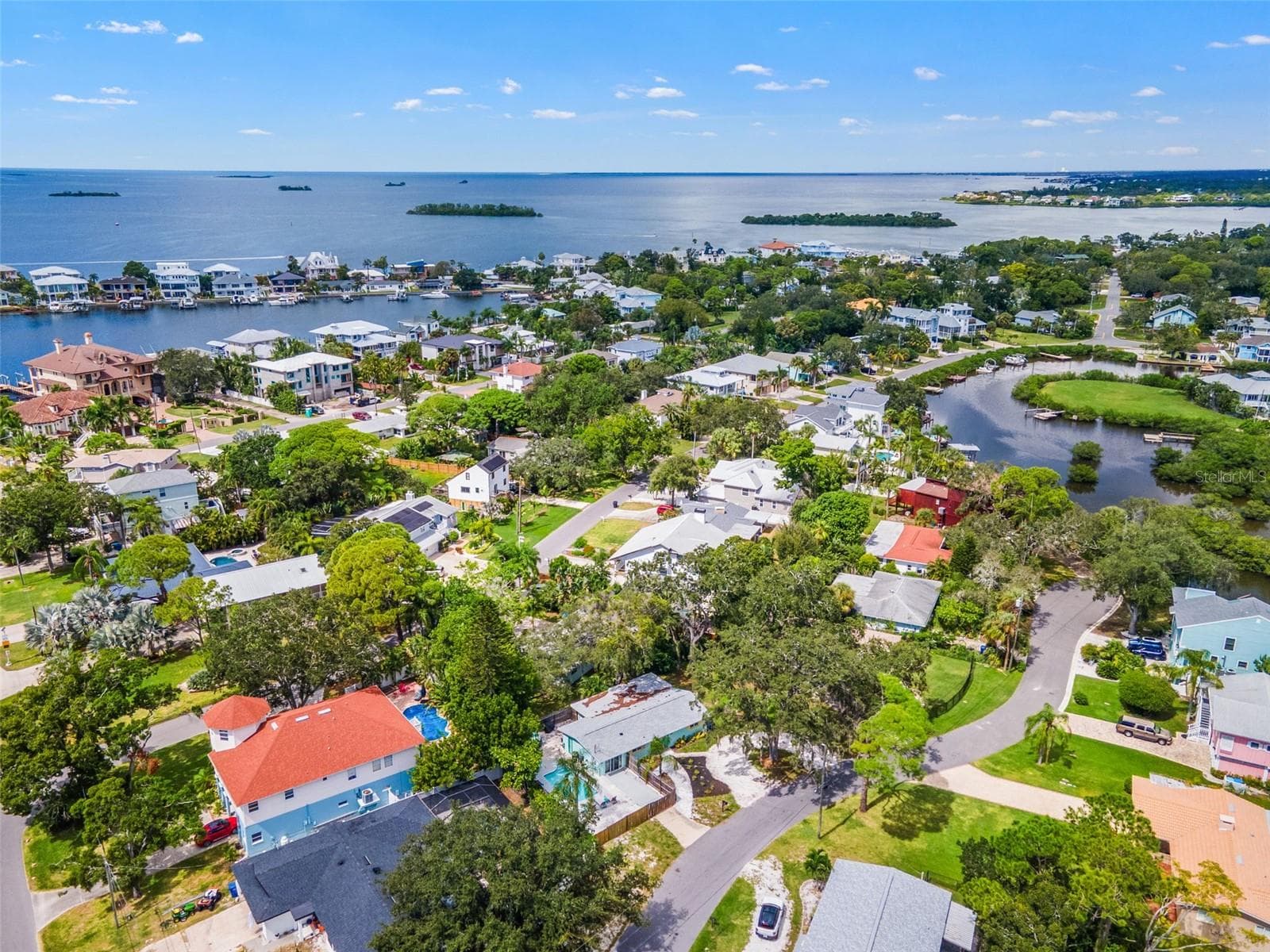 Sweeping aerial view of Ozona and St. Joseph Sound—an incredible location for enjoying the boating, biking, dining, and laid-back coastal lifestyle. - 201 SOUTH ST, PALM HARBOR