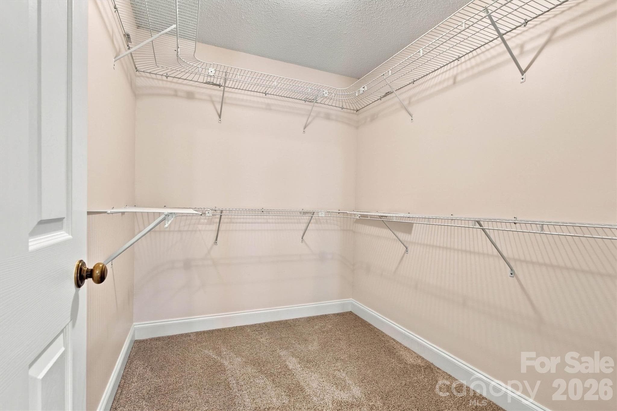 1 of 2 Primary Ensuite Walk-In Closets - 3656 Woodgreen Drive, Lincolnton