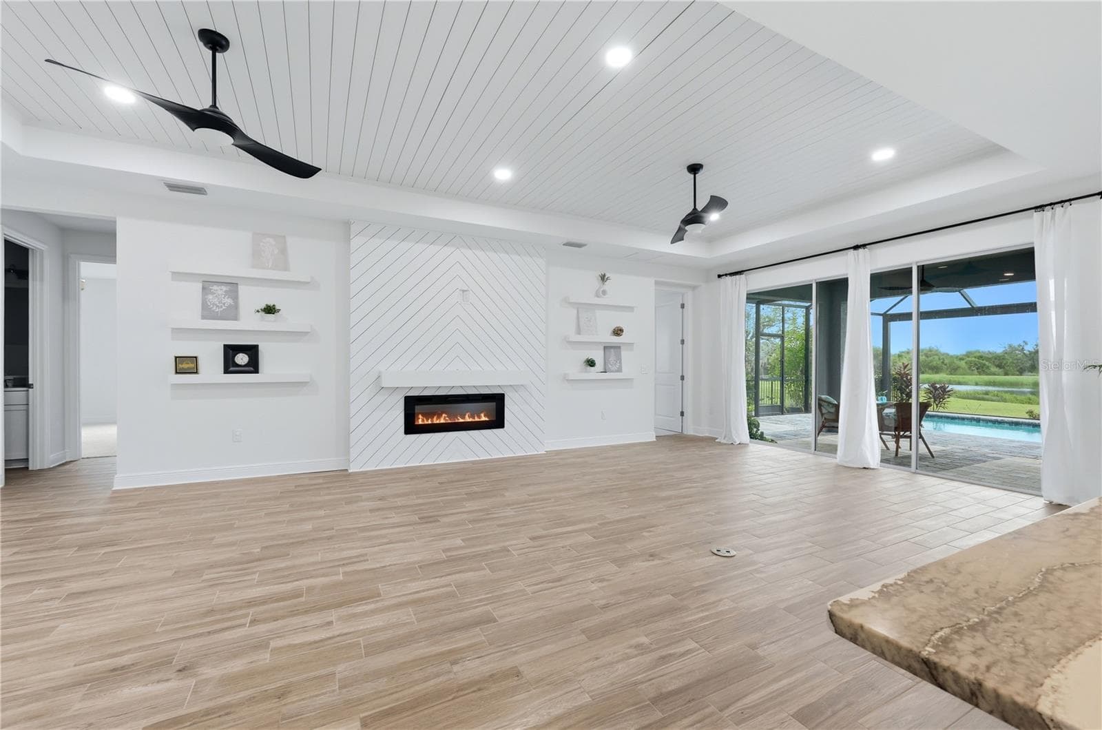 Great Room with electric fireplace - 5542 NATIVE HENNA CT, SARASOTA