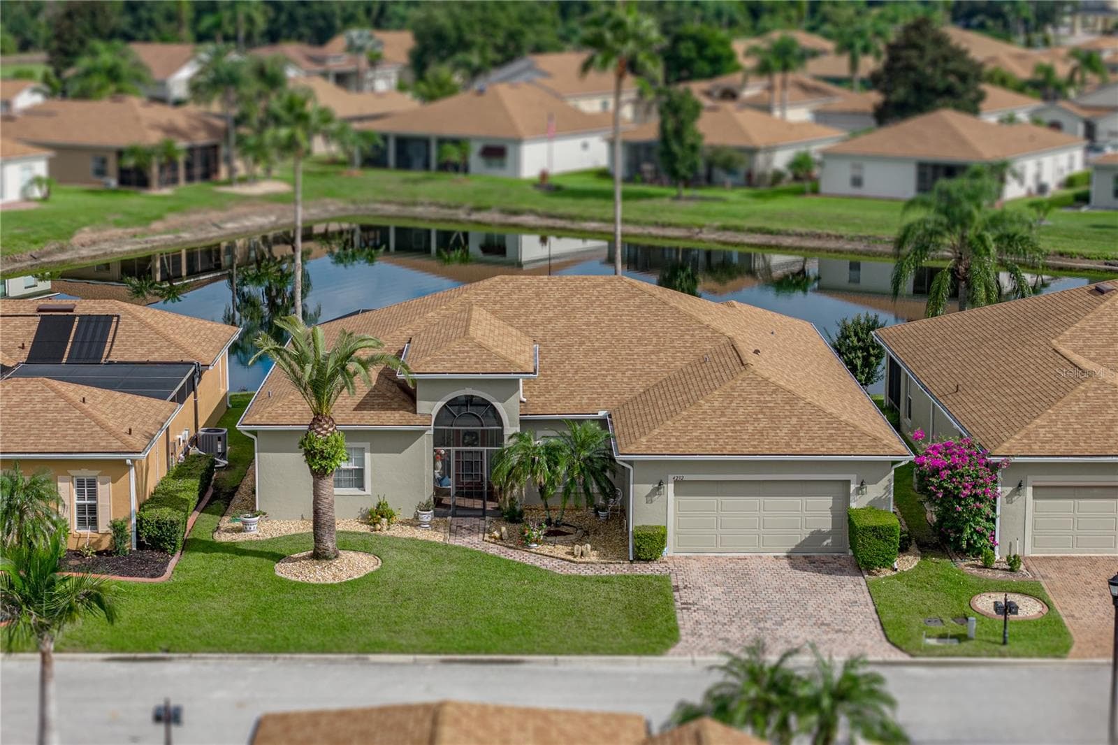 This home is located on a quiet street and backs up to a large pond. - 4232 DORNOCH DR, LAKE WALES