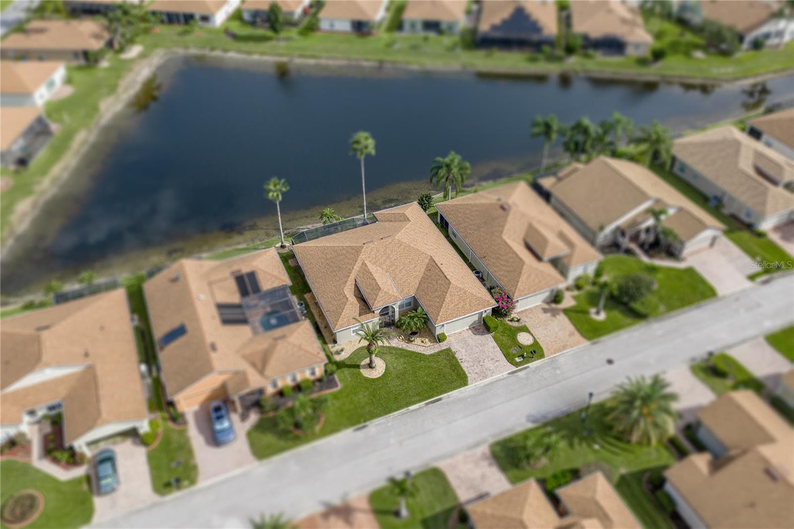 The home abuts a large pond. - 4232 DORNOCH DR, LAKE WALES