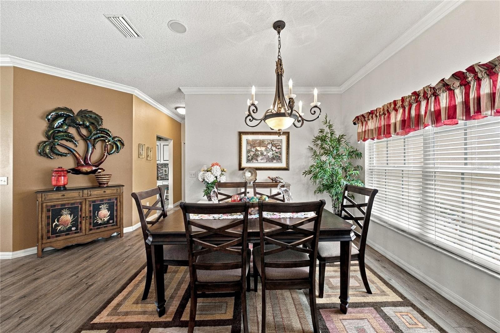 The dining room sits at the front of the home and is enhanced by the double window. - 4232 DORNOCH DR, LAKE WALES