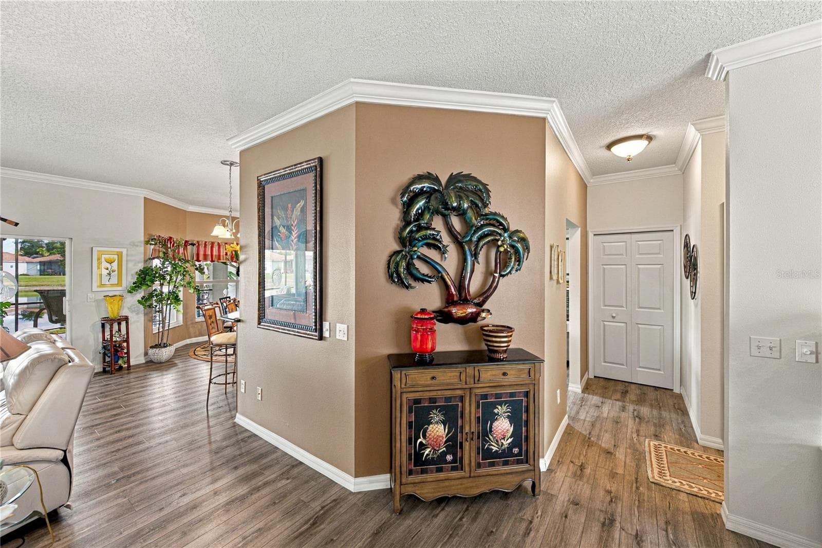 The presence of crown molding throughout the home adds class! The closet pantry is on the right. - 4232 DORNOCH DR, LAKE WALES