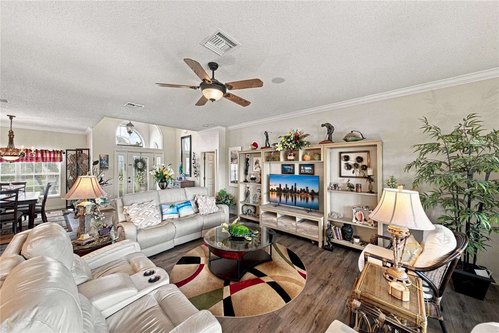 This view of the living room shows the foyer and dining room blending together. - 4232 DORNOCH DR, LAKE WALES
