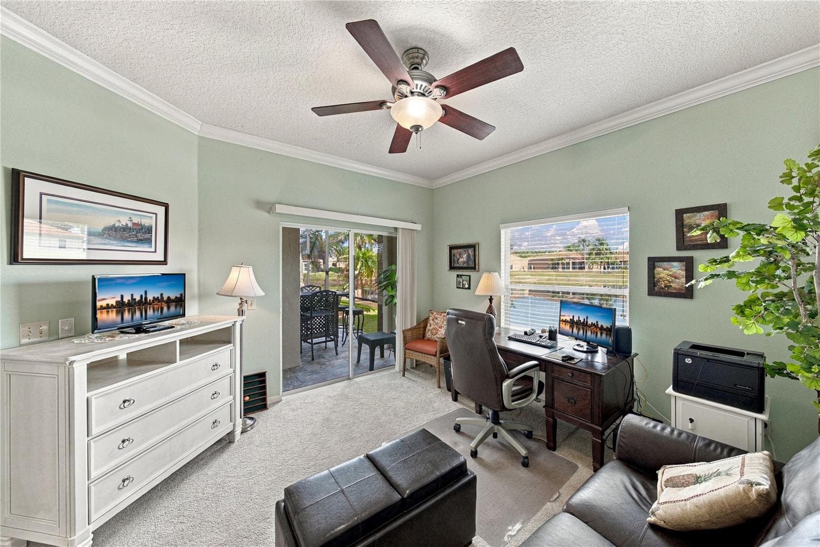 The third bedroom has a double slider that opens to the lania. - 4232 DORNOCH DR, LAKE WALES