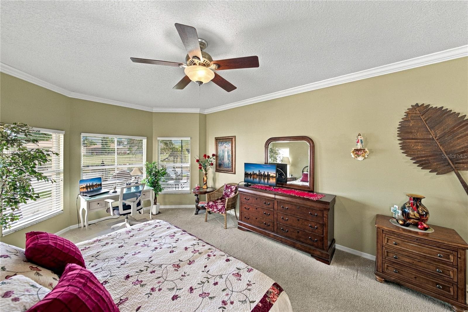 The size of the primary bedroom can easily accommodate your bedroom furnishings. - 4232 DORNOCH DR, LAKE WALES