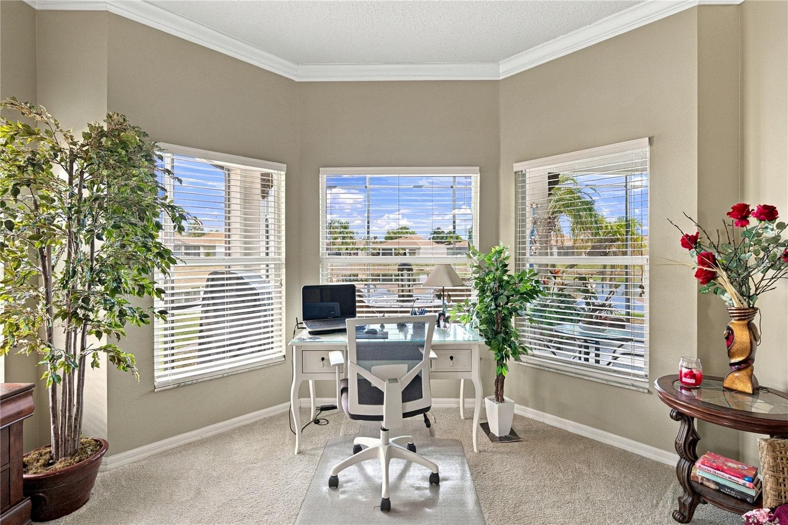 The bay window area in the primary bedroom offers a great view of the pond behind. - 4232 DORNOCH DR, LAKE WALES