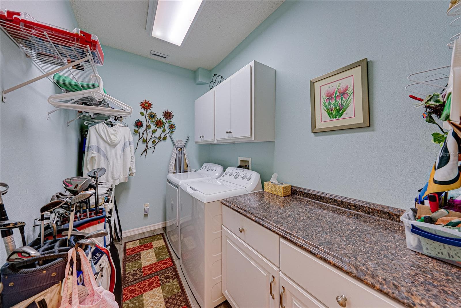 The inside laundry room is just off the kitchen and features additional storage and cabinetry. The new washer and dryer stay. - 4232 DORNOCH DR, LAKE WALES