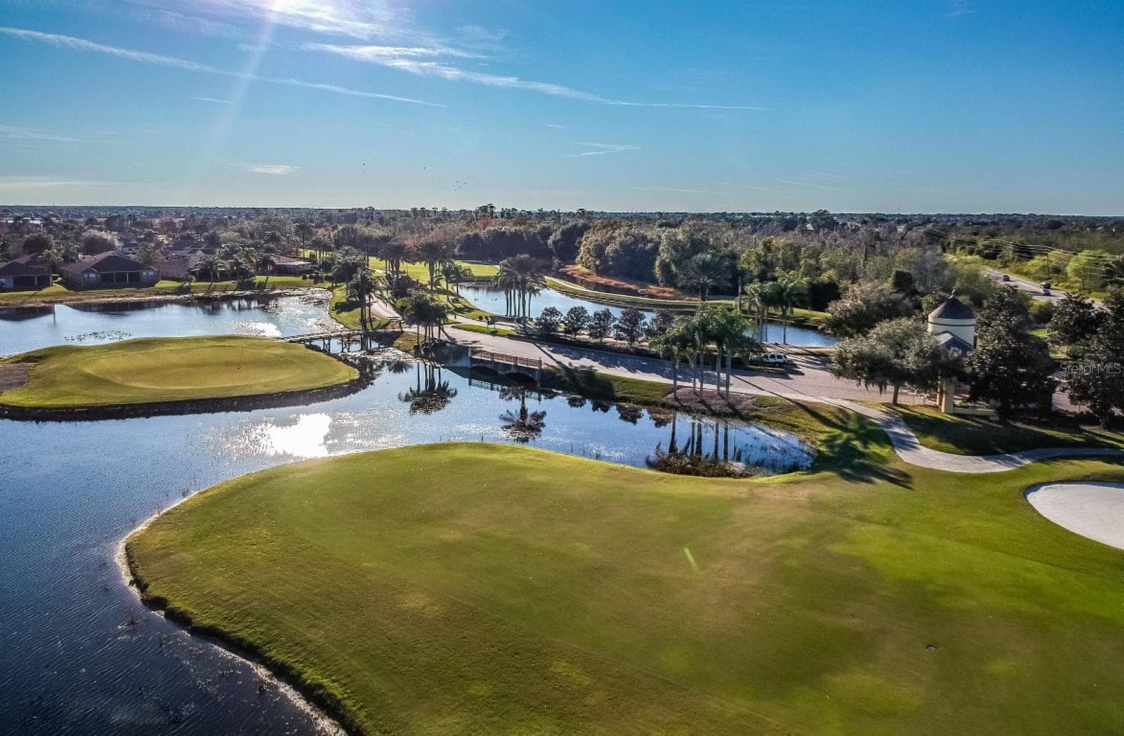 Lake Ashton has 2 par 70 private courses that residents can join. A variety of membership options exist. This is a view of the East Course's signature par 4 island green hole. - 4232 DORNOCH DR, LAKE WALES