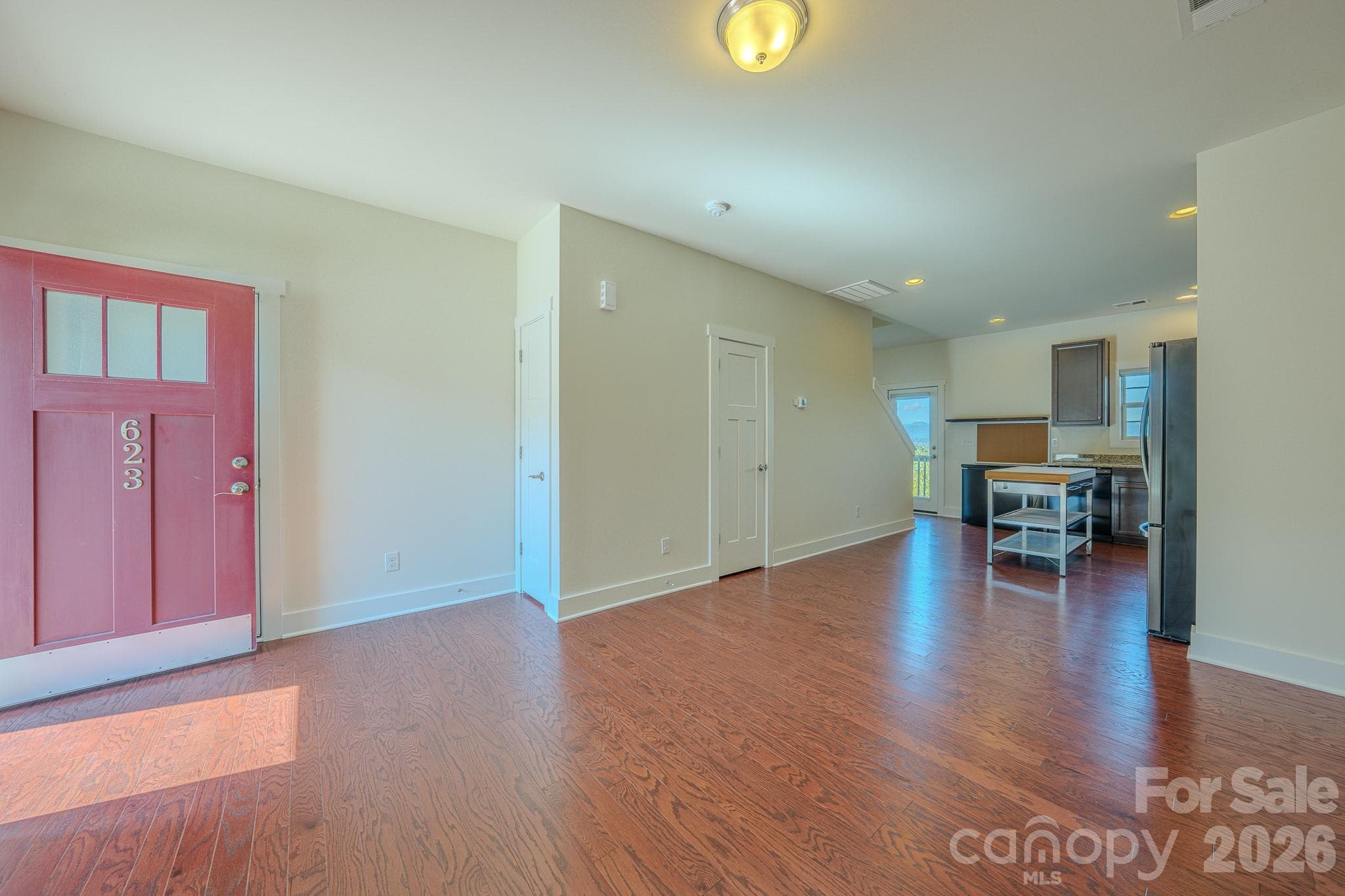 Living Room, door to 1/2 bathroom - 623 Cardwell Lane, Fletcher