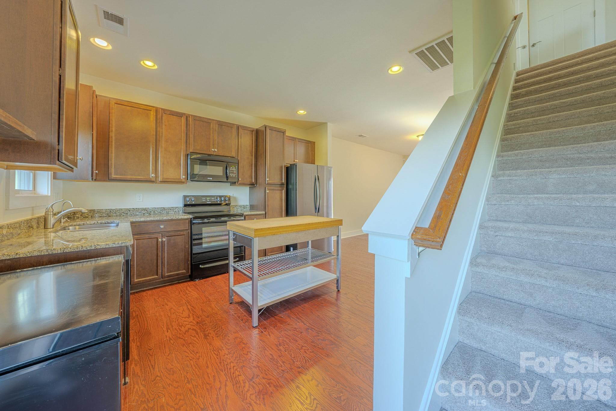 Kitchen with stairs leading to bedrooms - 623 Cardwell Lane, Fletcher