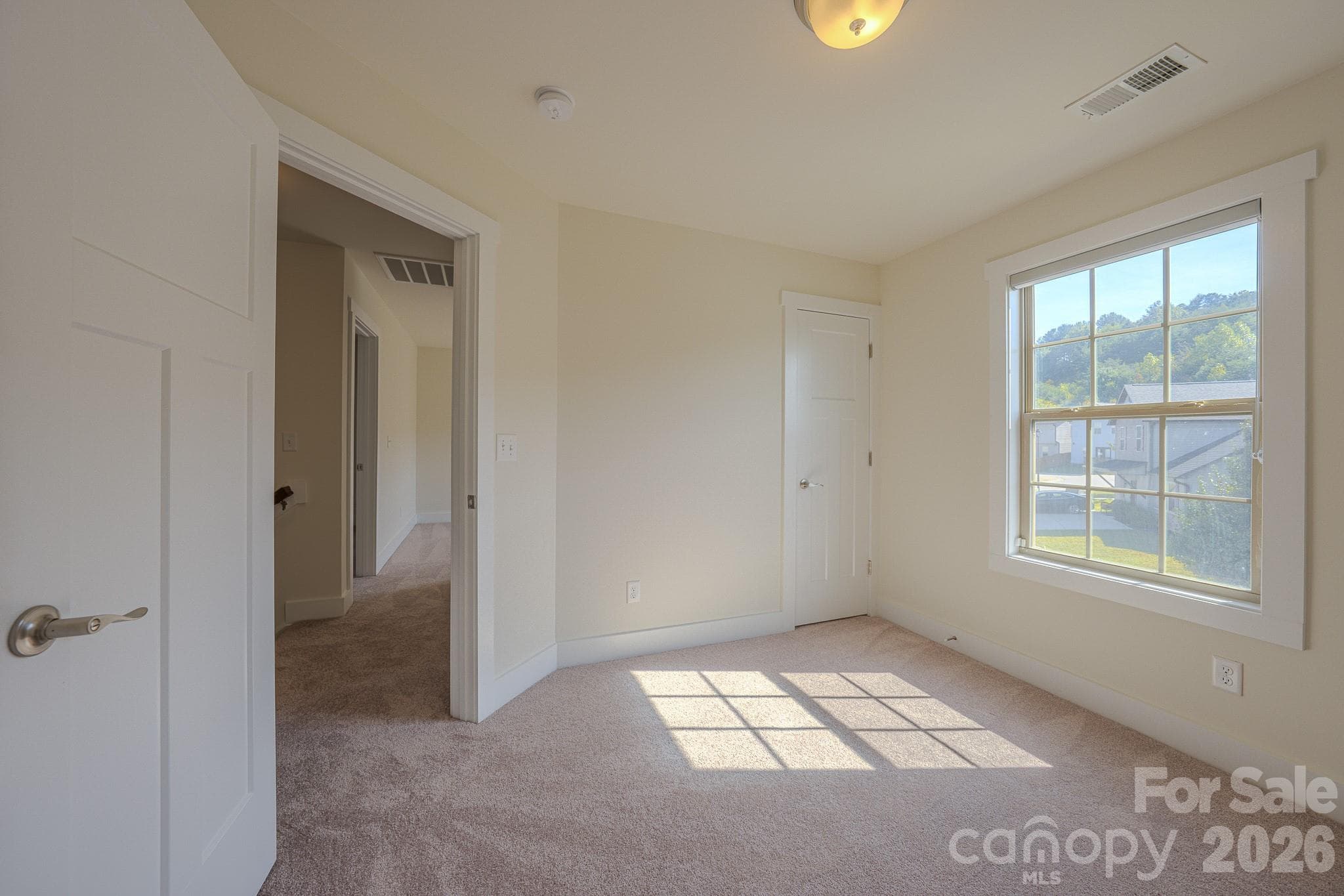 Bedroom 2, door on right to large walk-in closet with window - 623 Cardwell Lane, Fletcher