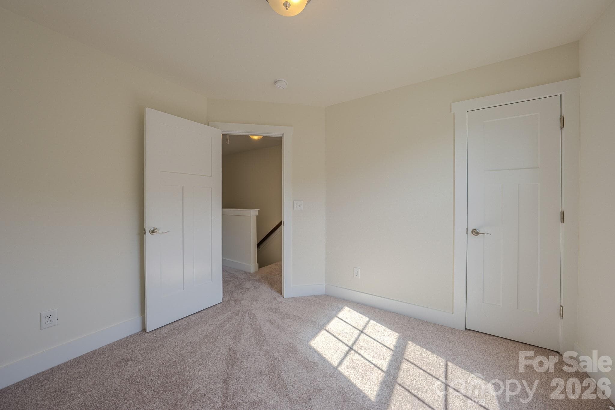 Bedroom 2, door to right with large walk-in closet with window - 623 Cardwell Lane, Fletcher