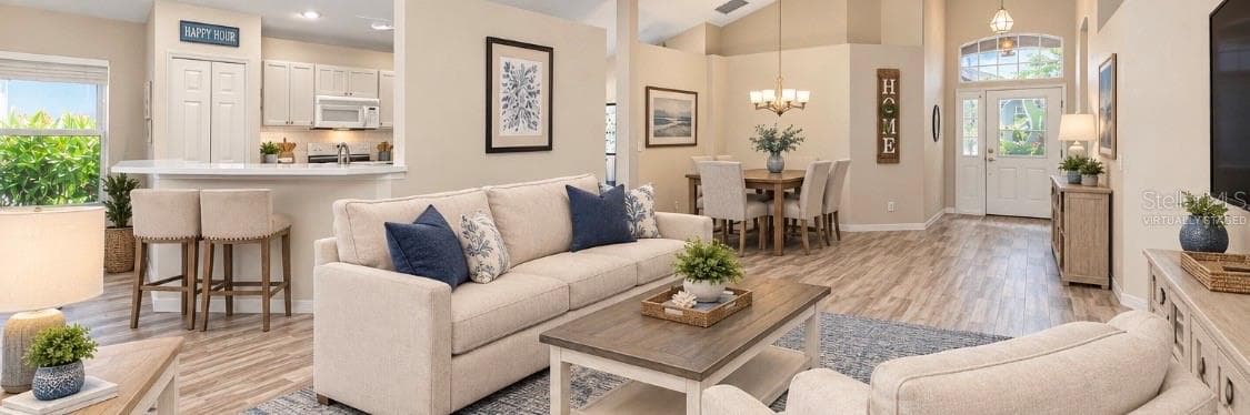 Virtually Staged Combined living and dining room. - 5113 FLAGSTONE DR, SARASOTA